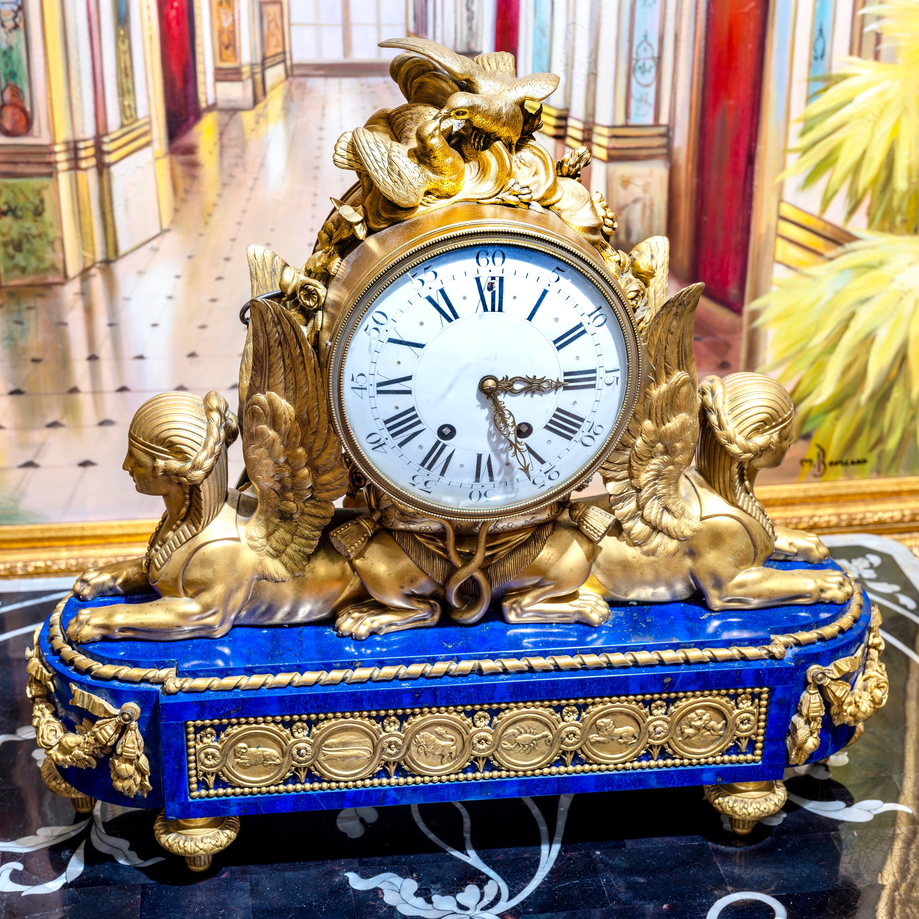 19th century French mantle clock with bronze winged figures