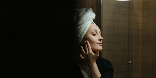 Night time routine woman applying night cream