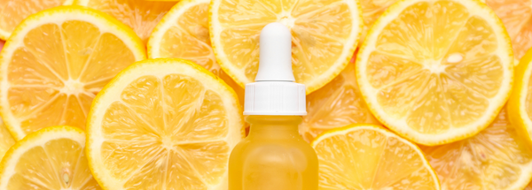 Image of skincare bottle on lemons