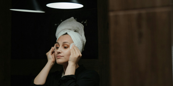 Night time routine woman cleansing her face