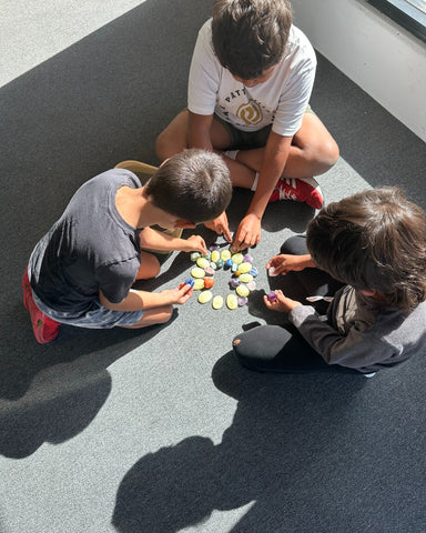 A group of children learn to create Crystal Grids