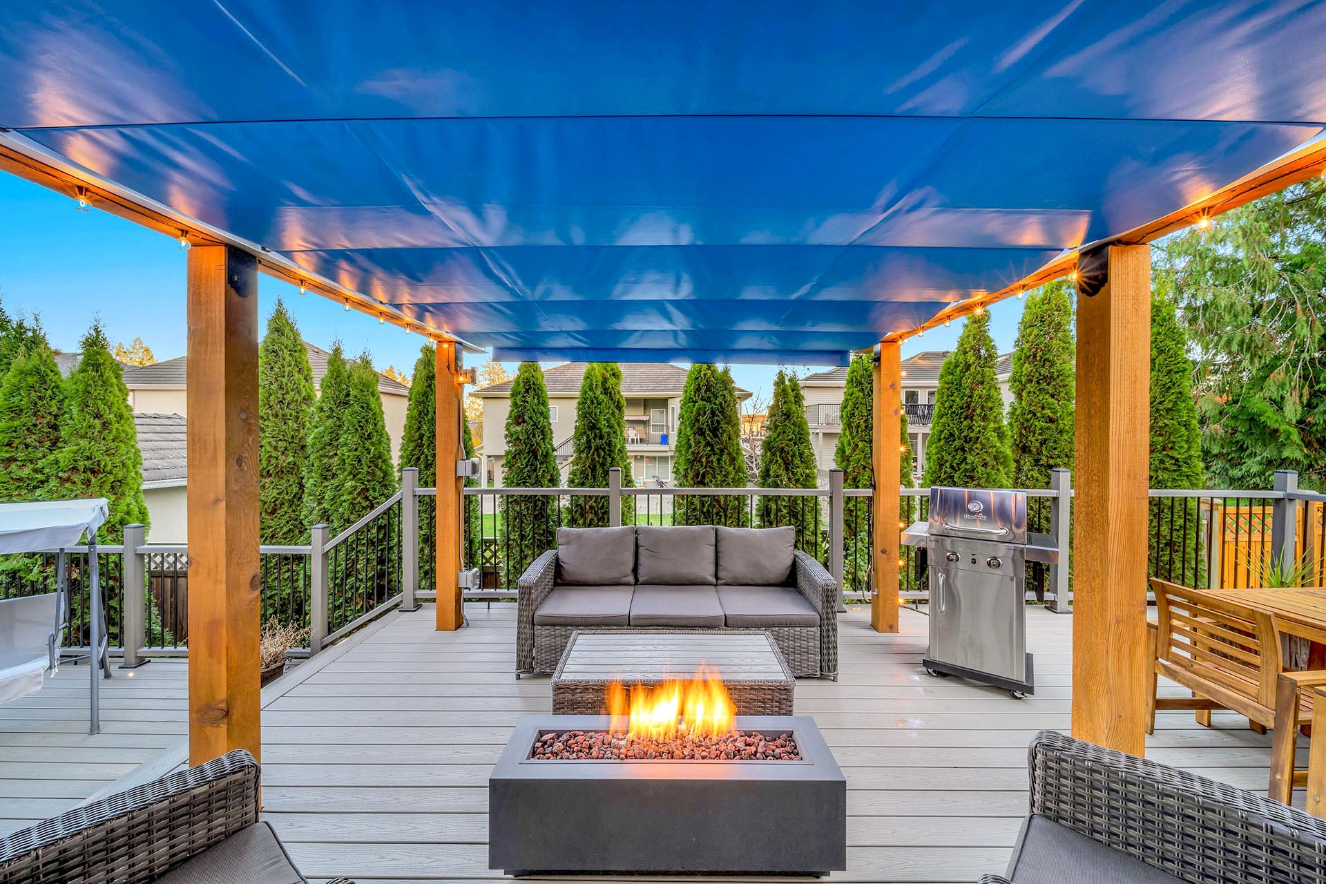 blue retractable canopy over an outdoor living space