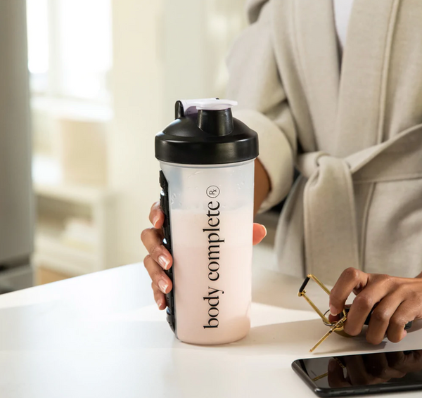 Shaker bottle for protein shakes with pill case