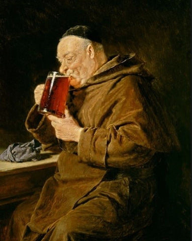 Monk drinking beer in a monastery