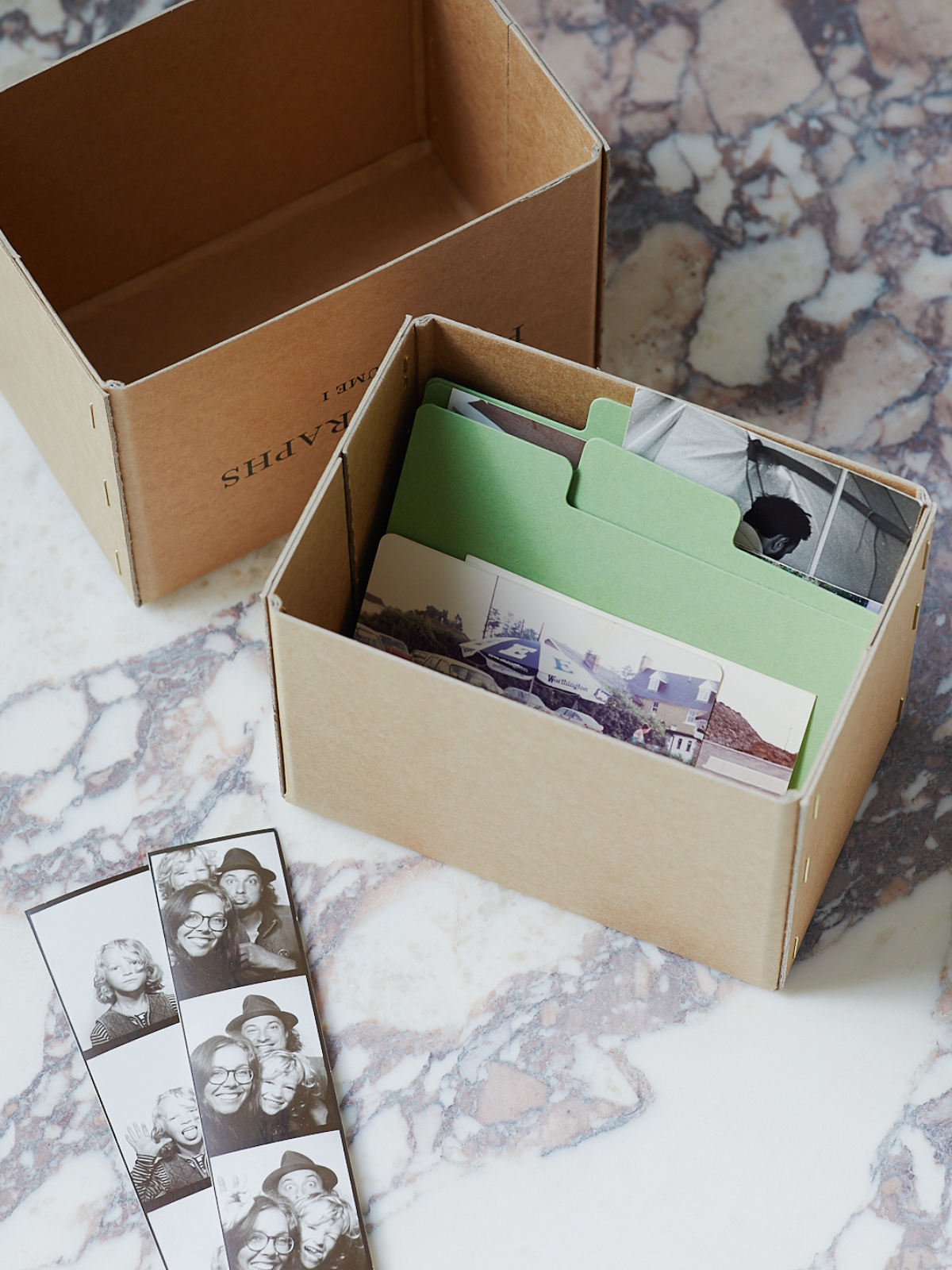 a letterpress photograph box filled with polaroid pictures of people smiling for World Mental Health Day