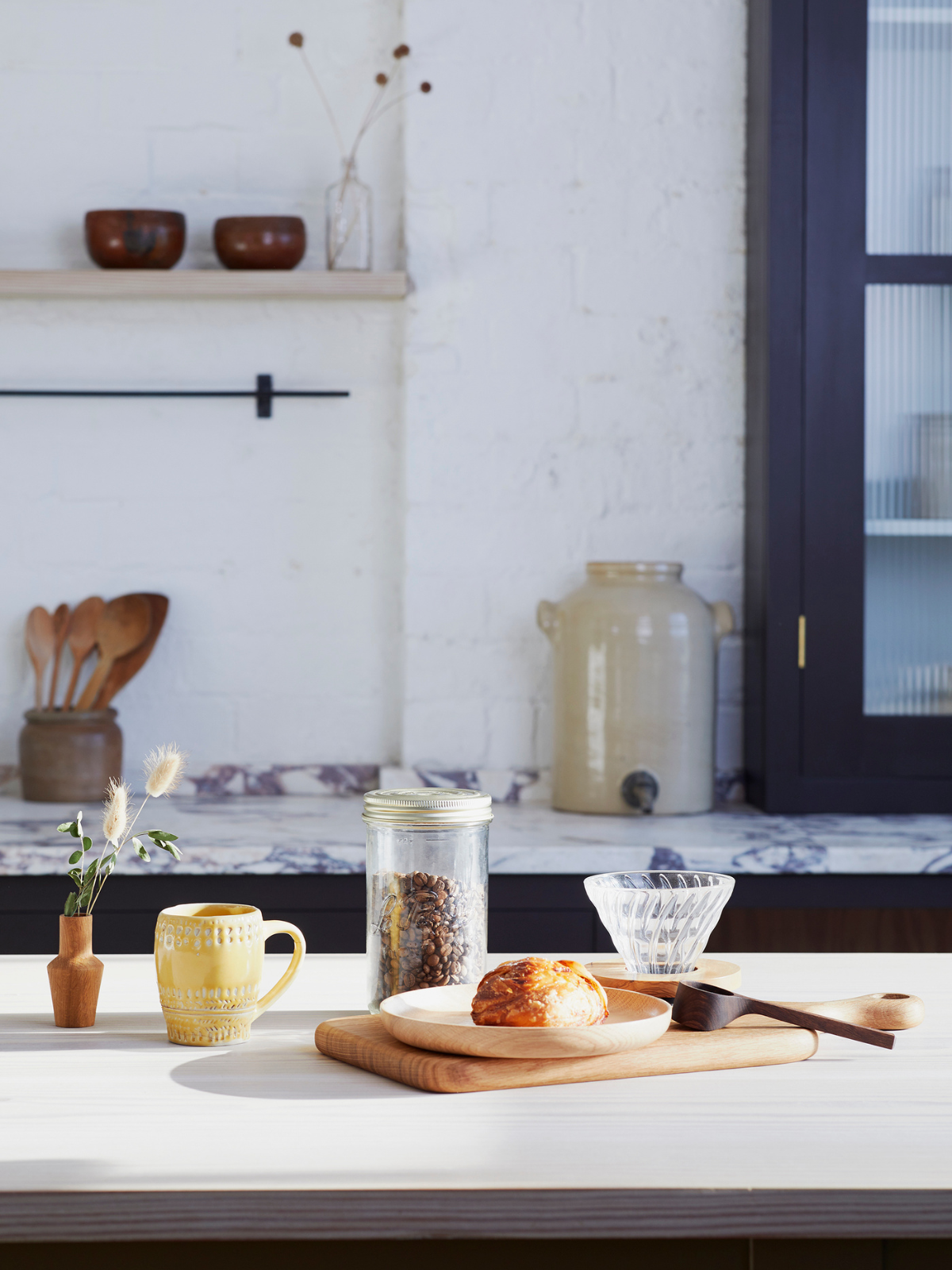 a breakfast table scene with artisan objects