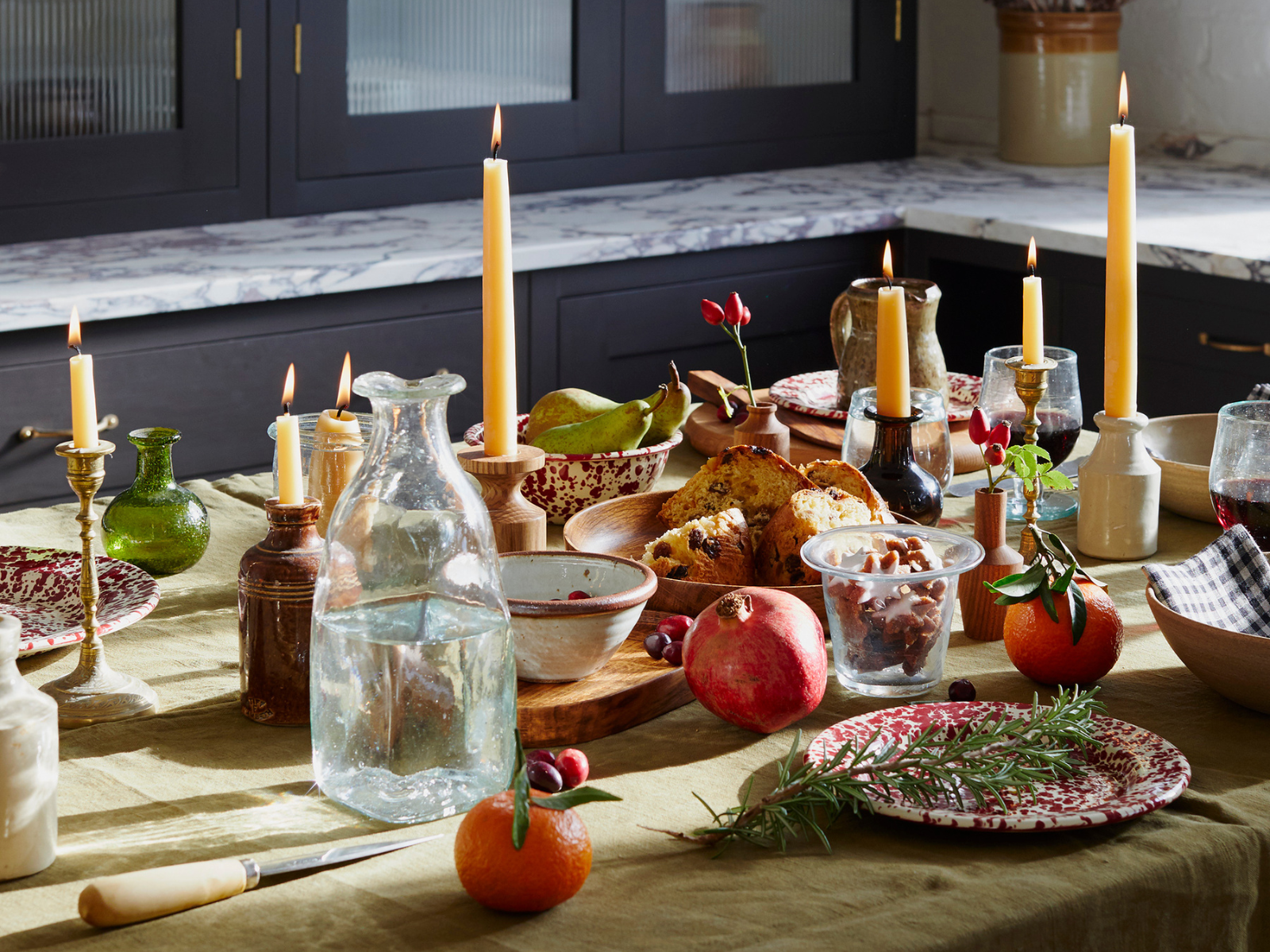 A Christmas table filled with candles and food