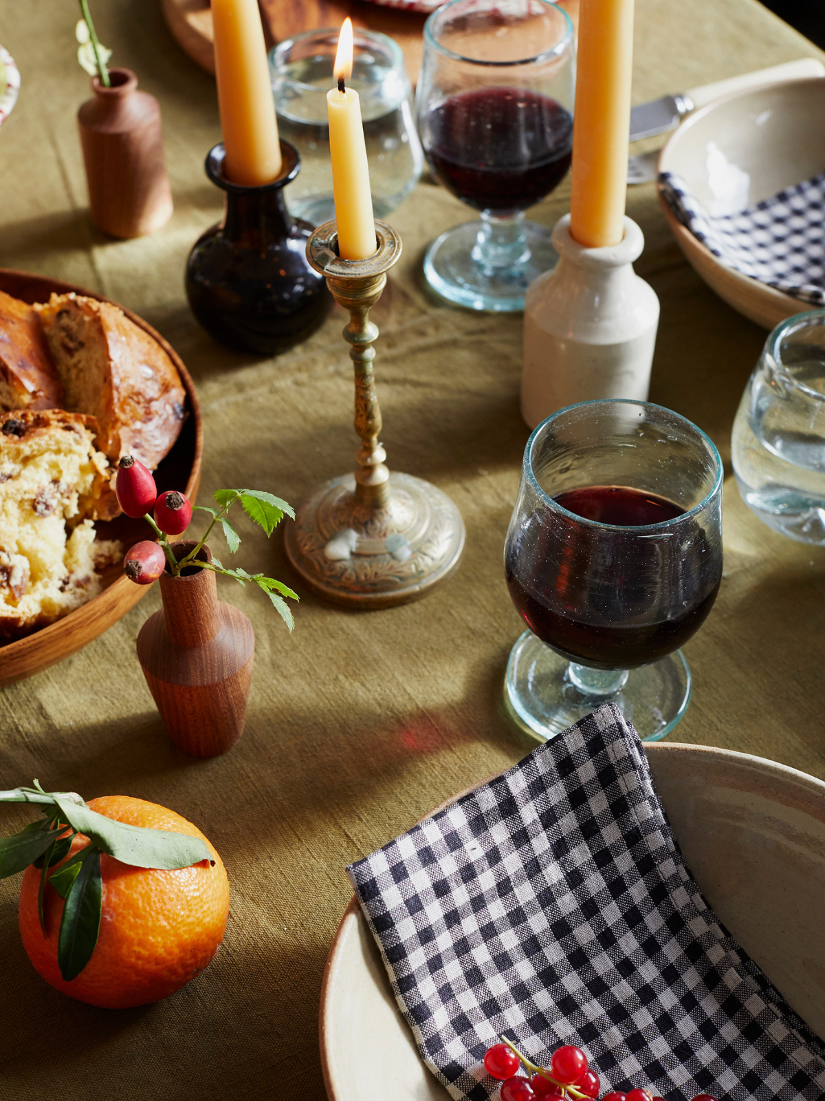 Wine, candles and tableware on a Christmas table