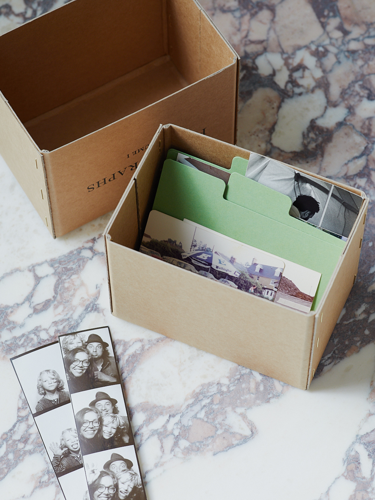 a Mabel & co letterpress archive box with photobooth photographs inside