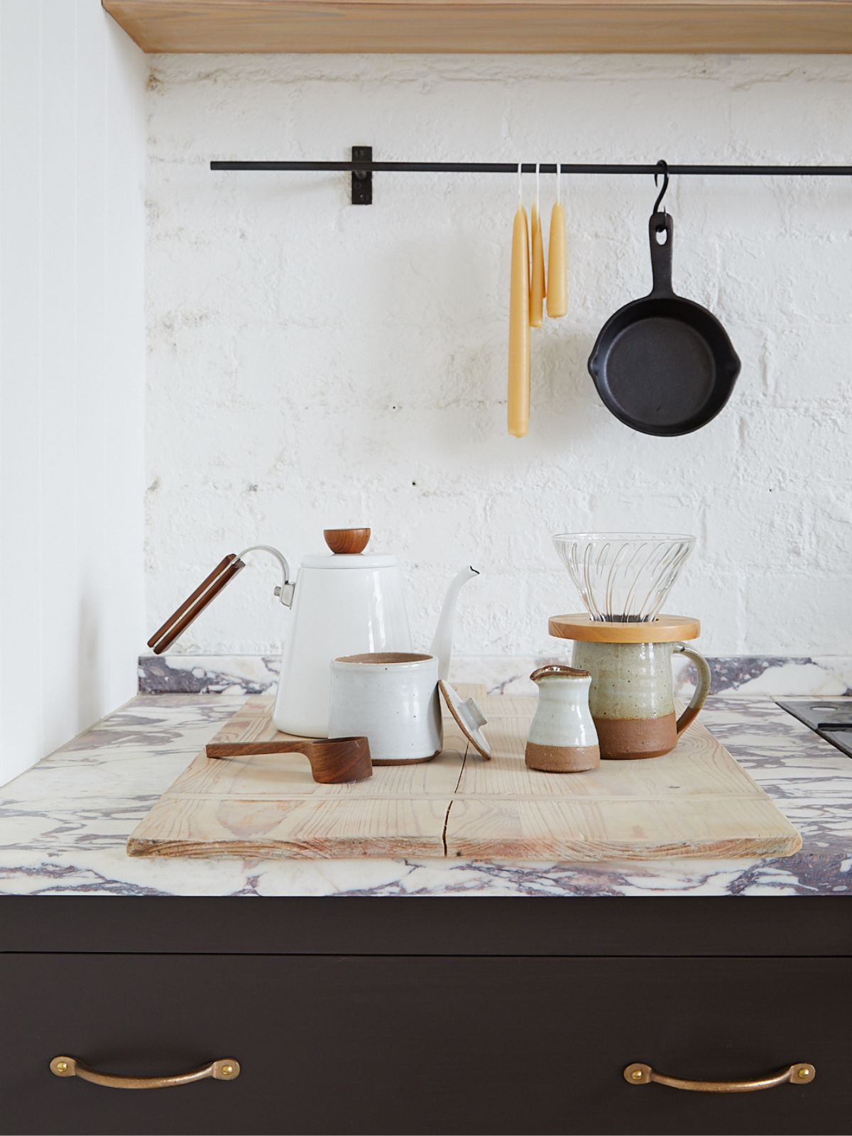 An enamel coffee pot in a kitchen