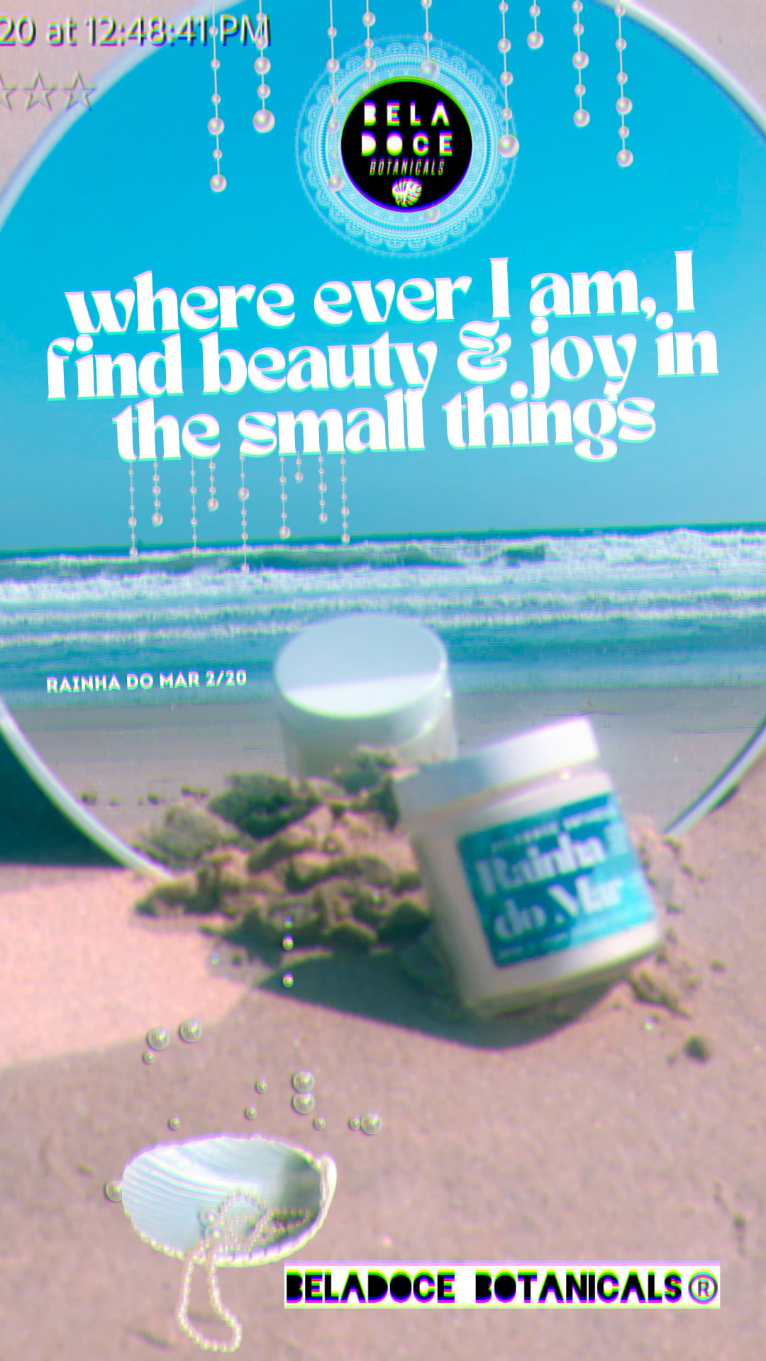 Wherever I am, I find beauty and joy in the small things. image description: 2020 photo of beladoce rainha do mar candle aesthetic product photo, candle in mirror on white sands, beach & ocean reflects in mirror behind the candle. Positive affirmation in white text above says “wherever I am, I find beauty and joy in the small things”