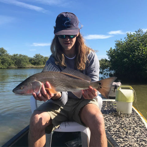 Dean holds a recently caught redfish.