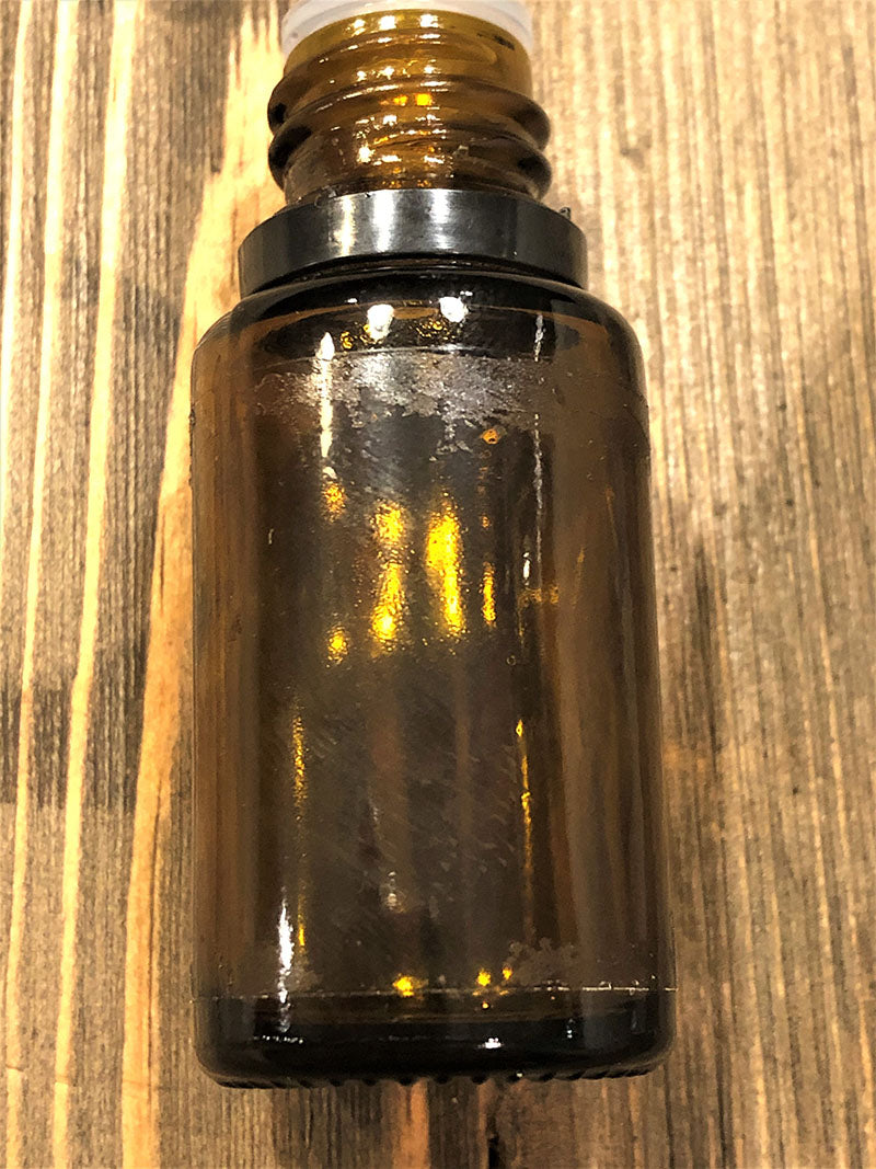 Removing label from essential oil bottle