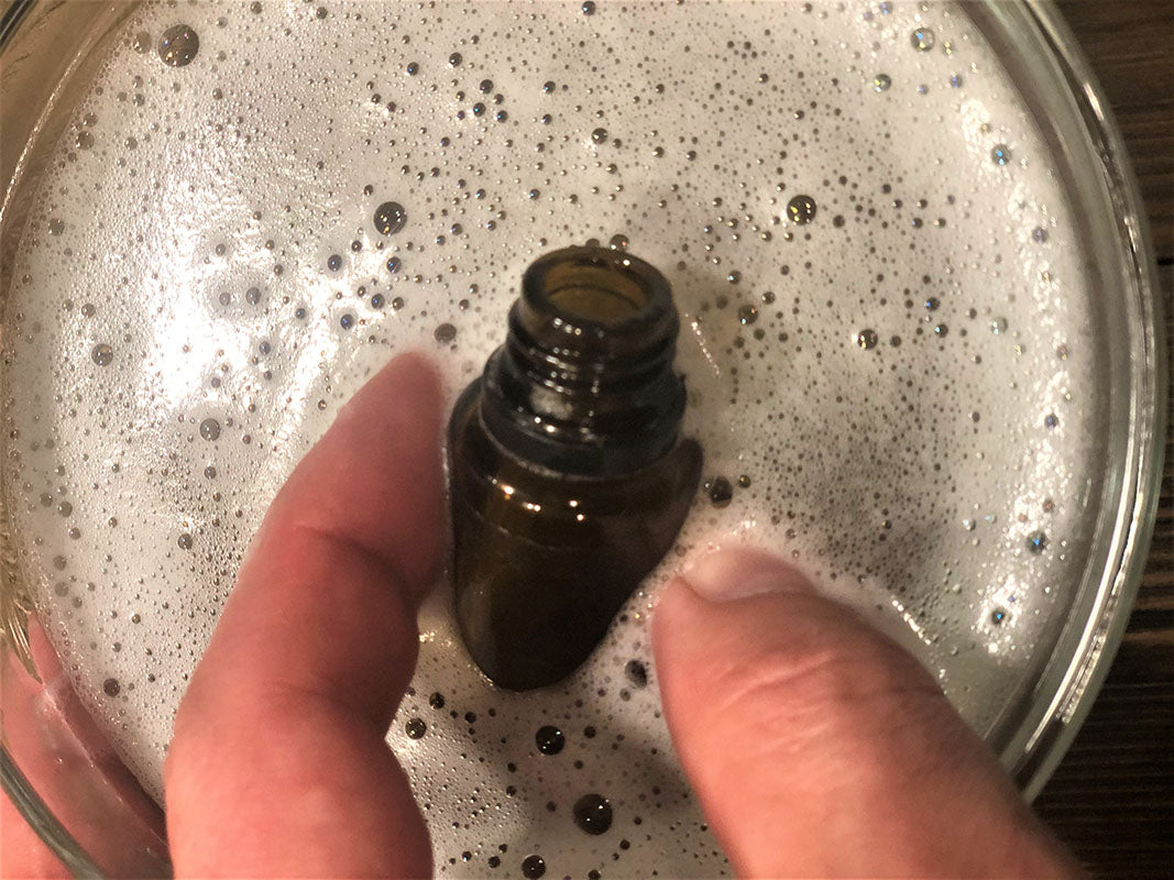 Removing label from essential oil bottle