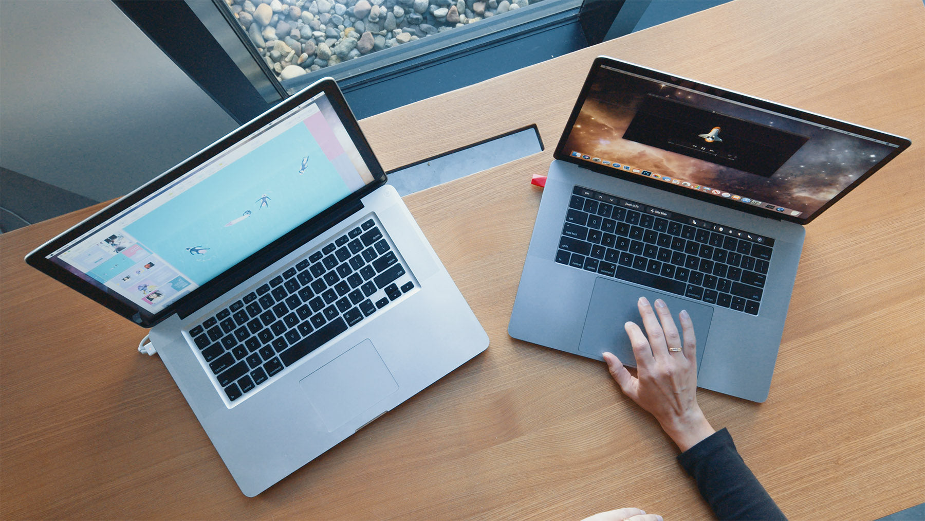 Two laptops sitting next to each other. 