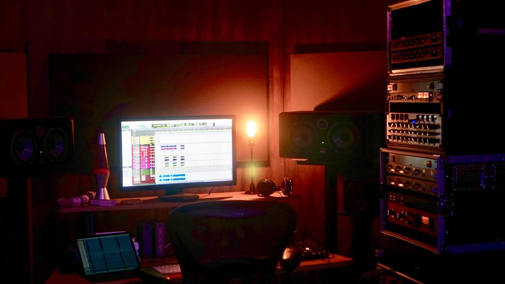 Michael Pepe's computer setup within his dark recording studio. 