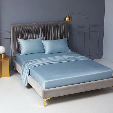 A king-sized bed featuring our Lyocell Fitted Sheet in light sky blue.