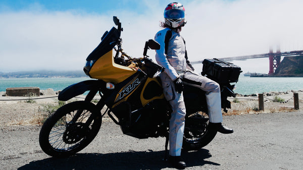 Image of model in Raven Rova Falcon Pants and Falcon Jacket on a Kawi KLR650