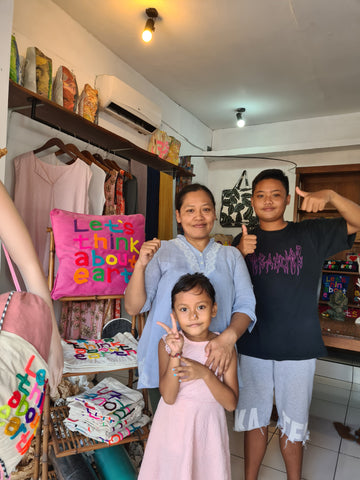 Ayu and her kids in her Bali shop