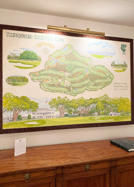 An illustration of the Timuquana golf course, grandly displayed on a wall in a dark wooden frame.