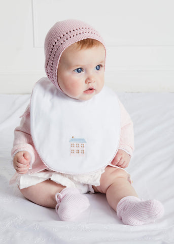 Newborn wearing a Pepa London bib