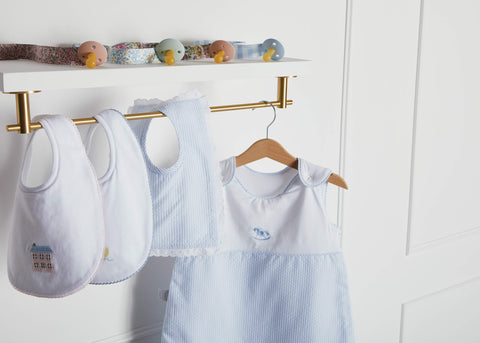 White baby and toddler clothes on a hunger