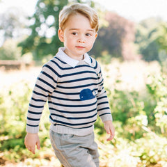 Image of Prince George from his third birthday photoshoot, wearing the Pepa London Whale Intarsia Striped Jumper.