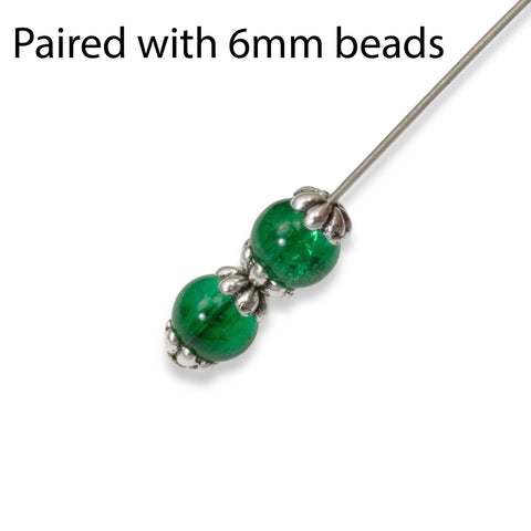 silver petal bead caps on green beads