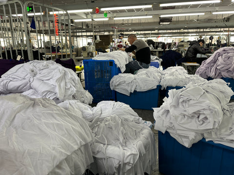 white t-shirts waiting for the next step in production