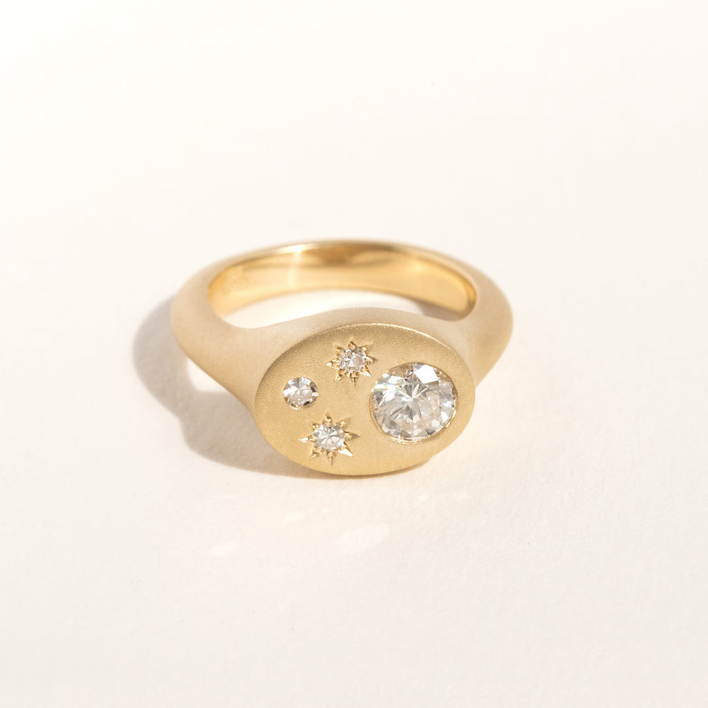 Bryce's updated signet ring using her heirloom diamonds.