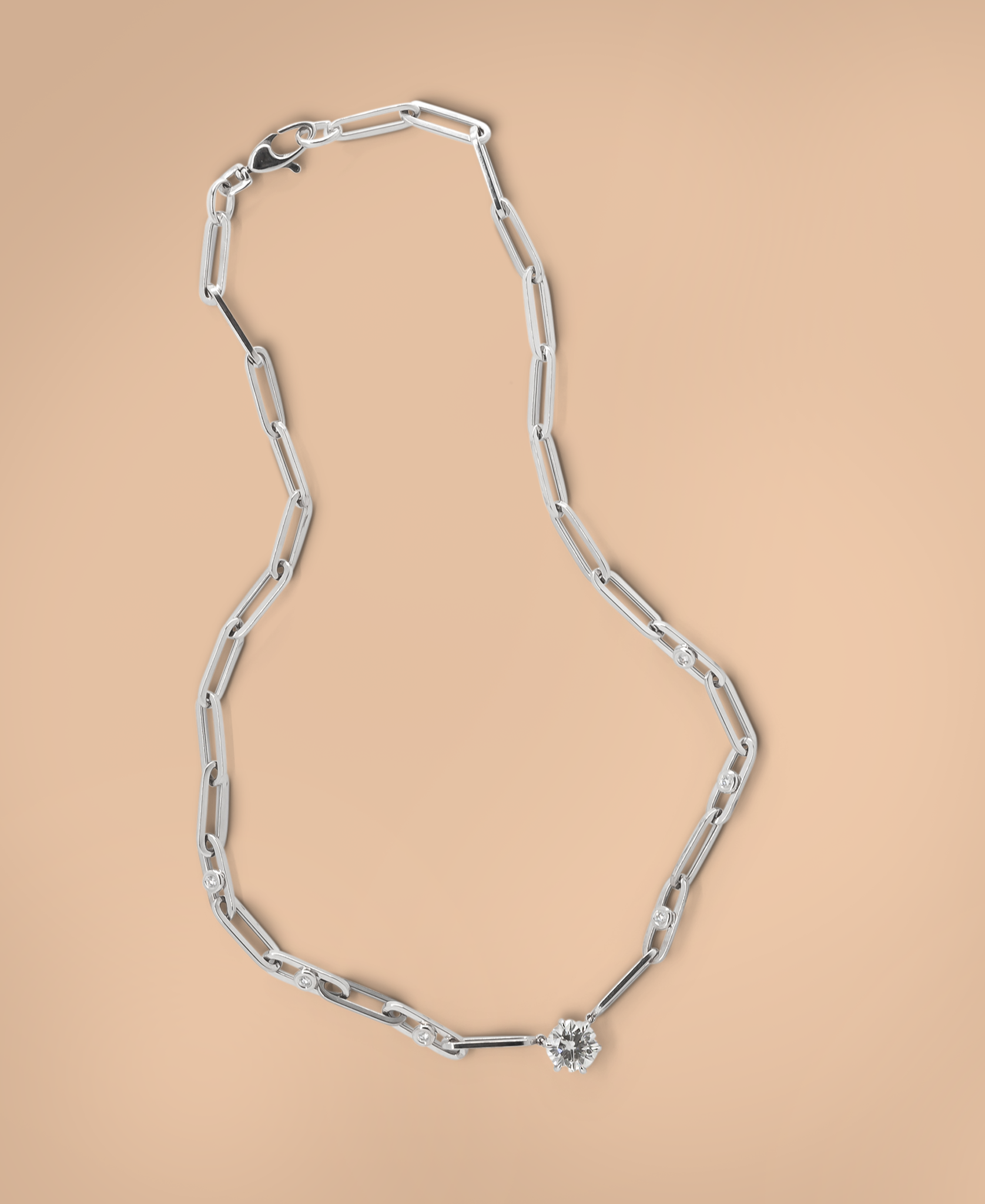 Caroline's inherited diamond set in a bold paperclip chain.