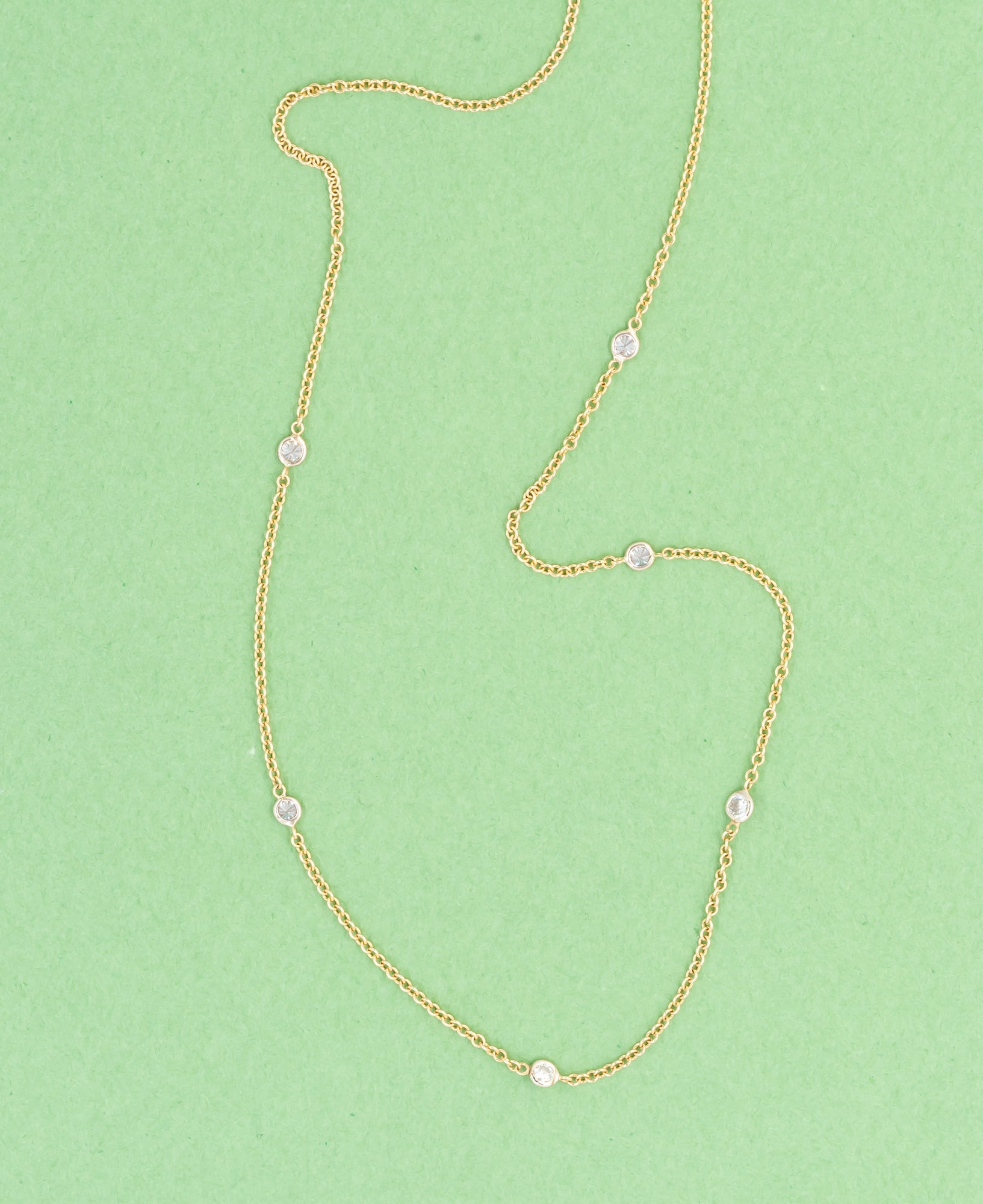 Tiny antique diamonds set in a delicate 14kt yellow gold chain.