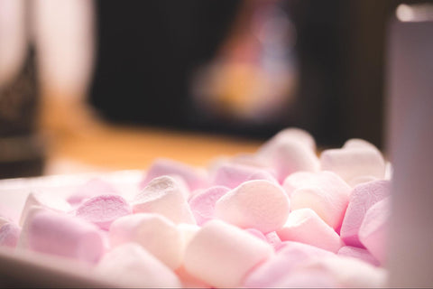 A close-up photo showcasing the soft and fluffy texture of white marshmallows