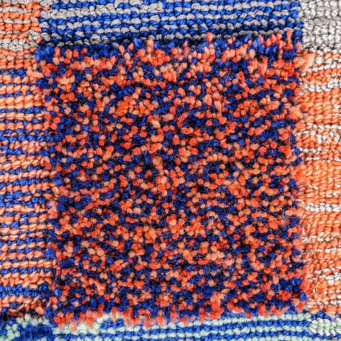 grapefruit and peach fuzz reflect wool tufted rug example