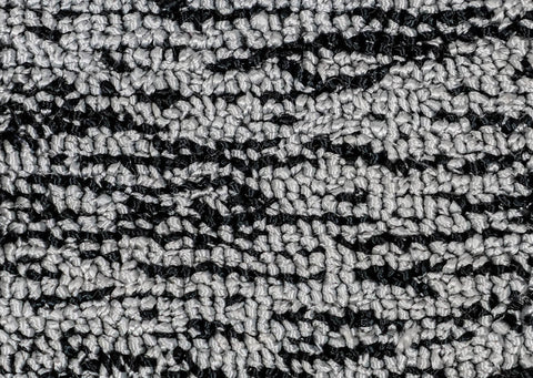 black and gray tufted rug up close tuft the world