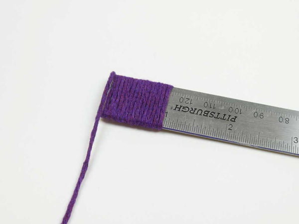 Recycled yarn wraps per inch