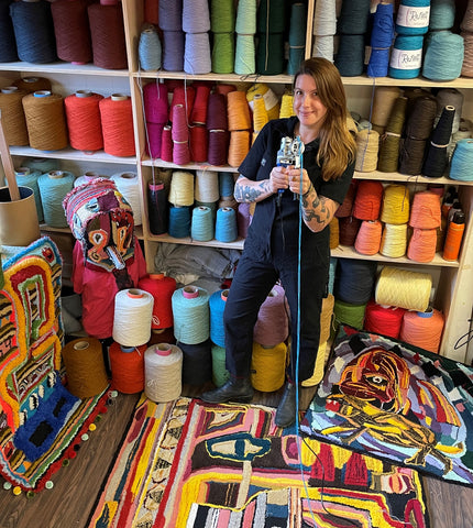 melissa monroe in home studio surrounded by yarn and fiber tuft the world