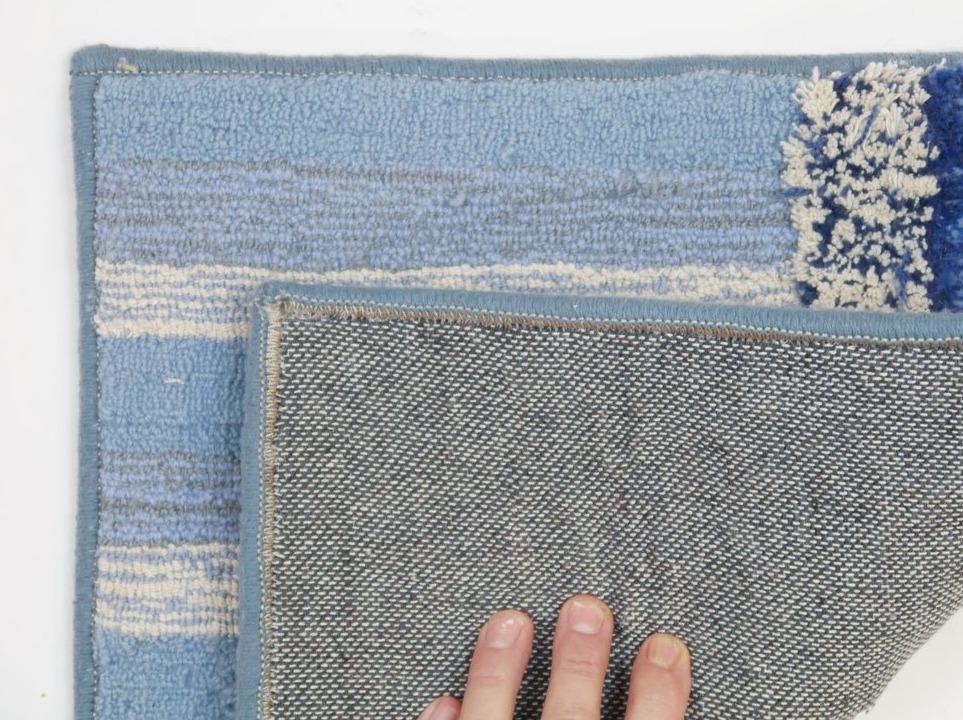 Rugs with material on the back