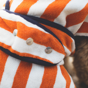Orange and white stripe drying coat with poppers