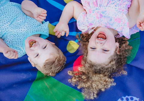 two toddlers on Picnic Season Really Big Picnic Rug 