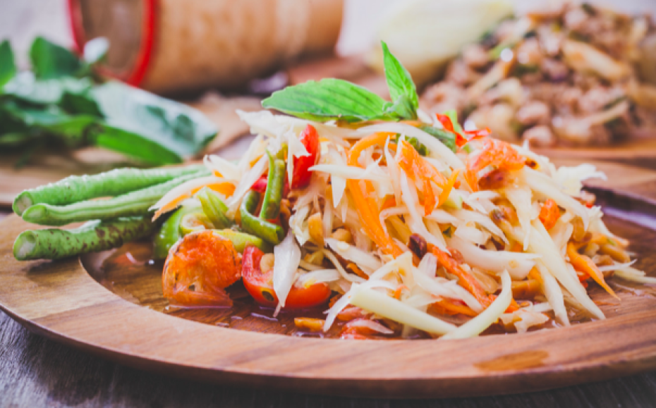 Som Tum, a famous Thai dish made from papaya, mango with sweet and tangy taste