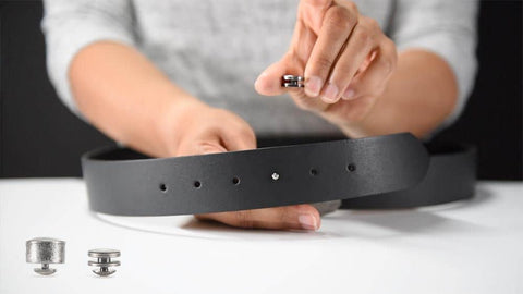 hand with leather strap and nub parts. these belts are intriguing gift ideas for engineers