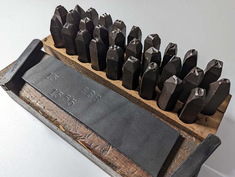 Case of leather punches are helpful tools for small leather working projects. There is one metal stamp for each letter of the alphabet