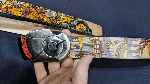 This one of a kind belt super belt is a perfect accessory for cosplay. Antique silver and red belt buckle from Obscure Belts on a comic strip leather strap from Jon Wye.