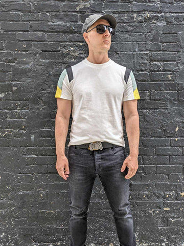 the enigma's antiqued metal and brass buckle look great on streetwear style clothing for a cool and casual look for men