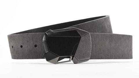 angular matte black belt buckle with antique silver style accents on a grey distressed leather belt for men