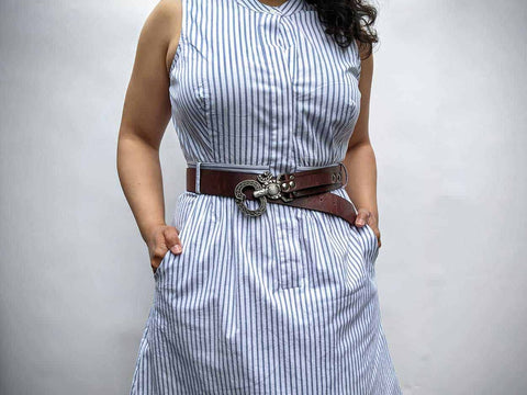 ohm 2.0 belt worn at the waist with a pinstripe dress. ohm belts are the perfect waist belts.