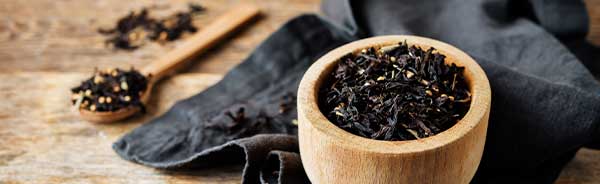 black tea in wooden cup assam tea