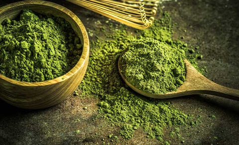 matcha green tea powder with bamboo whisk