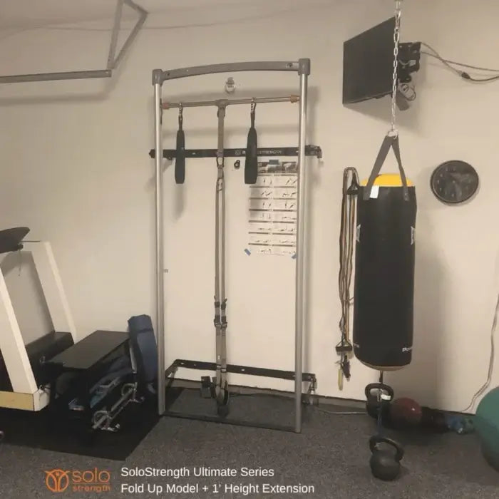 wall mounted fold up gym with adjustable height pull up bar dip station and rack